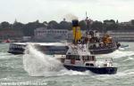 ID 10337 2016 AUCKLAND ANNIVERSARY DAY REGATTA TUG AND TOWBOAT RACE. The crew of the Royal New Zealand Navy Commodore's launch see a gap in the harbour traffic astern of the preserved steam tug WILLIAM C....