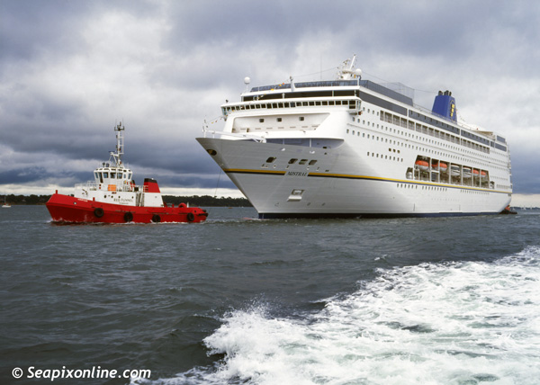 MISTRAL (1999/47276grt/IMO 9172777. Renamed GRAND MISTRAL in 2005, COSTA neoRIVIERA in 2013, AIDAmira in November 2019. Then sold to UK's Ambassador Cruise Line and renamed AMBITION in 2022)  arriving at Southampton, England direct from the ship builders, for presentation to the UK travel trade and media. She is escorted by the Red Funnel tug HAMTUN. Acquired by Costa Cruises in 2013, she now sails as COSTA neoRIVIERA. 1999. Photo by SeapixOnline.com/Trevor Coppock