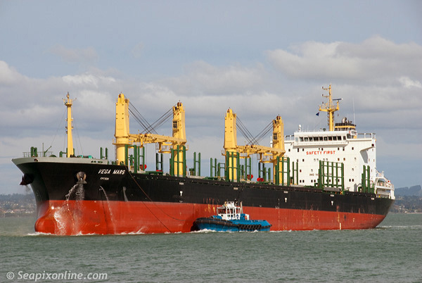 VEGA MARS (2011/19994gt/IMO 9497438) approaches the Auckland Harbour Bridge as she sails for Tauranga following an eight-day dischage at the Chelsea Sugar Refinery. She arrived originally from Kashima, Japan. 10 October 2011. Photo by SeapixOnline.com