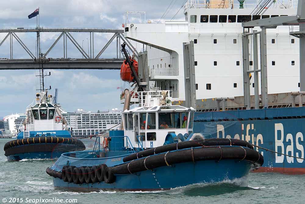 Ports of Auckland tugs WAKA KUME (2000/338grt/IMO 9212084) and HAURAKI (2014/250grt/124dwt/IMO 9681015) assist the bulk carrier CHAMPION BAY on her arrival in Auckland from Maceio, Brazil. 17 December 2015. Photo by Â© 2015 SeapixOnline.com