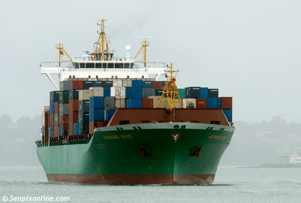 HERMANN WULFF (2006/32200grt/38975dwt/IMO 9316373, ex- IBN KHALLIKAN, OOCL ENERGY) arrives in pouring rain for her maiden call at Auckland, New Zealand. 23 July 2012. Photo by SeapixOnline.com