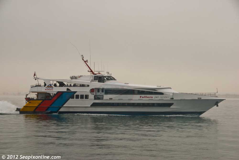 JET RAIDER (1990) - a commuter ferry operated by Fullers of Auckland, arrives at Devonport ferry terminal in dense fog. 24 July 2011. Photo by SeapixOnline.com