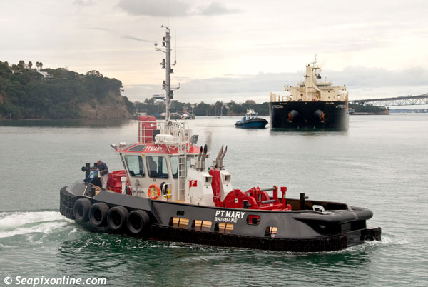 P.T. MARY (2012/54grt) a 15m harbour tug with 17 tonne bollard pull, constructed by Ship Co Marine Constructors Ltd of Whangarei, New Zealand. She's a sister ship to P.T. MAY which was also built for Pacific Tug of Brisbane, Australia. She is seen here preparing for line handling working during the docking of the bulk carrier LYTTELTON at Auckland's Chelsea Sugar Refinery. 14 July 2012. Photo by SeapixOnline.com