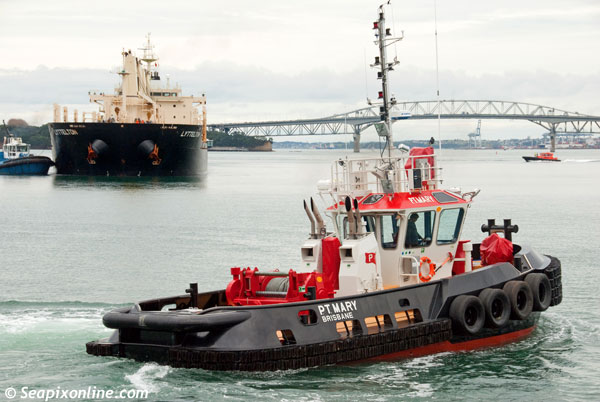 P.T. MARY (2012/54grt) a 15m harbour tug with 17 tonne bollard pull constructed by Ship Co Marine Constructors Ltd of Whangarei, New Zealand. She's a sister ship to P.T. MAY which was also built for Pacific Tug of Brisbane, Australia. She is seen here preparing for line handling work during the docking of the bulk carrier LYTTELTON at Auckland's Chelsea Sugar Refinery. 14 July 2012. Photo by SeapixOnline.com
