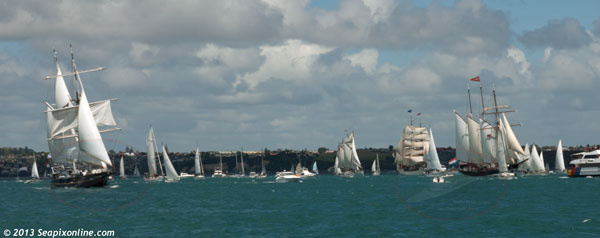 YOUNG ENDEAVOUR (left) JANE GIFFORD (centre), EUROPA and Oosterschelde accompanied by a large farewell flotilla make their way along the Rangitoto Channel offshore from Takapuna as the tall ships leave Auckland. 28 October 2013. Photo by © 2013 SeapixOnline.com