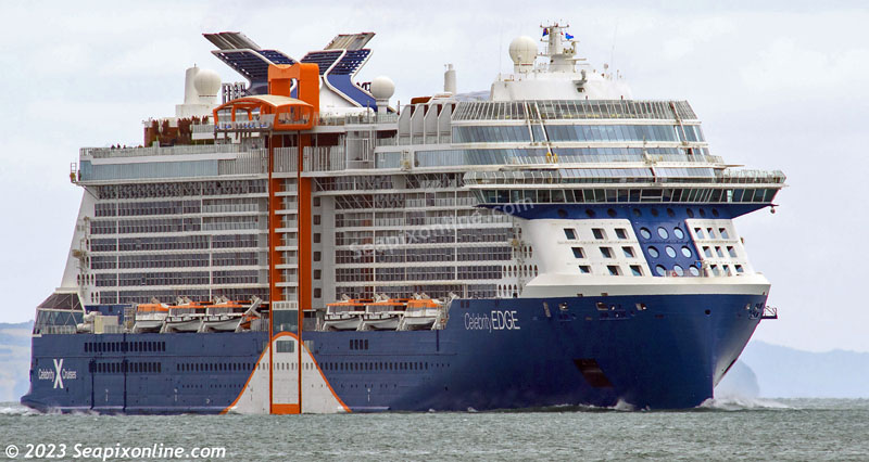 CELEBRITY EDGE (2018/130818gt/IMO 9812705) - costing US$1billion (according to Wikipedia), one of the most spectacular cruise ships ever to visit New Zealand and the lead vessel of Celebrity Cruises Edge-class ships, arrived in port after a quick Tasman crossing from Sydney.
She is the very first of this class of cruise ship to visit Australasian water and is seen here approaching the northern end of the Rangitoto Channel around 4km away and as she enters the Waitemata Harbour before berthing at Auckland's Prince's Wharf.
 12 December 2023 . Photo by Â© 2023 SeapixOnline.com