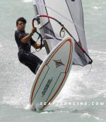 ID 3541 WINDSURFER - enjoys a stiff breeze on Auckland's Waitemata Harbour, New Zealand.