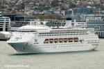 ID 7054 PACIFIC DAWN (1991/69845grt/IMO 8521232, ex-REGAL PRINCESS. Renamed SATOSHI and then AMBIENCE in 2021 following acquisition by UK's Ambassador Cruises) departs Auckland under gloomy skies bound for...