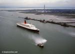 ID 7106 QUEEN ELIZABETH 2 (1969/70327grt/IMO 6725418) passing the Fawley Refinery inbound to Southampton, England from a German shipyard where repairs were made to damage sustained when she ran aground in...