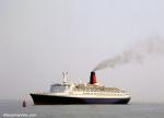 ID 7110 QUEEN ELIZABETH 2 (1969/70327grt/IMO 6725418) in the Thorn Channel, about to round Castle Point buoy near Calshot, inbound to Southampton, England.
