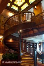 ID 6801 QUEEN ELIZABETH (2010/90901gt/IMO 9477498) - the ship's two-tier library complete with spiral staircase, one of only two at sea, the other being on Queen Victoria.