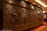 ID 5216 QUEEN MARY 2 (2003/148528grt/IMO 9241061) - One of the four bronze murals depicting significant destinations visited by Queen Mary 2 near the Pursers Office on Deck 2/3L.
This one depicts the USA and...
