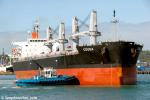 ID 7840 COUGA (2010/29104grt/50806dwt/IMO 9414905) arriving empty in Auckland, New Zealand from the Phillipines to load ironsand. The tug WAKA KUME assists at her bow.