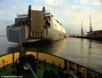 ID 8407 HUAL INGRITA (1980/33369grt/IMO 7900211, ex-INGRITA. Renamed HUAL TRUBADOUR, then HOEGH TRUBADOUR. Scrapped 2010) - berthing in Southampton, England seen from the Howard Smith tug FLYING KESTREL...