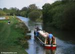 ID 7217 A narrowboat makes its' way slowly toward Hungerford along the Kennet and Avon Canal, Berkshire, England.