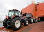ID 9066 NEW HOLLAND TRACTORS - loading aboard a vehicle carrier at Southampton docks, England.