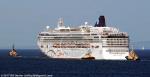 ID 10855 NORWEGIAN STAR (2001/91740grt/7500dwt/IMO 9195157) - owned and managed by NCL (Norwegian Cruise Line) she is seen here under tow to Melbourne, Australia having just negotiated The Rip at the entrance...