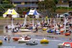 ID 8898 MURRAYS BAY SAILING CLUB, NEW ZEALAND - Competitors in a sailing regatta prepare their boats on the beach outside the Murrays Bay Sailing Club on Auckland's North Shore. Many of New Zealands' yachting...