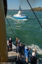 ID 8597 TAMAKI (1972/221grt/IMO 7226550) on the move to the first mark in the 2013 tug race. Passengers aboard the veteran steam tug WILLIAM C. DALDY, cameras at the ready, capture the action.