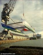 ID 8873 ROYAL & SUN ALLIANCE - is lowered into the water at Southampton Docks, England. One of the first Kevlar/carbon fibre offshore boats, she was built in 1982 to a design by Nigel Irens and launched as...