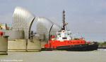 ID 8361 SUN SURREY (1992/378grt/IMO 9019468. Renamed ADSTEAM SURREY then SVITZER SURREY) passes through the Thames Barrier at Greenwich, London. As at 2012 she is based at Southampton sailing as SVITZER...