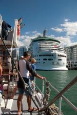ID 8720 VOYAGER OF THE SEAS (1999/137276grt/IMO 9161716) - Passengers aboard the preserved coal-burning tug WILLIAM C DALDY take  a close-up view of Royal Caribbeans' Eagle-class cruise ship during the...