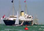 ID 12009 RY BRITANNIA (1953/5769gt/IMO 8635306) and the Jubille Sailing Trust's tall ship LORD NELSON, both at anchor off Cowes, Isle of Wight, during Regatta Week, 1996.